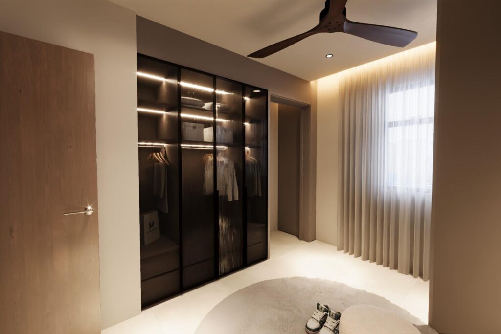 Glass-fronted wardrobe with concealed lighting beside a curtained window