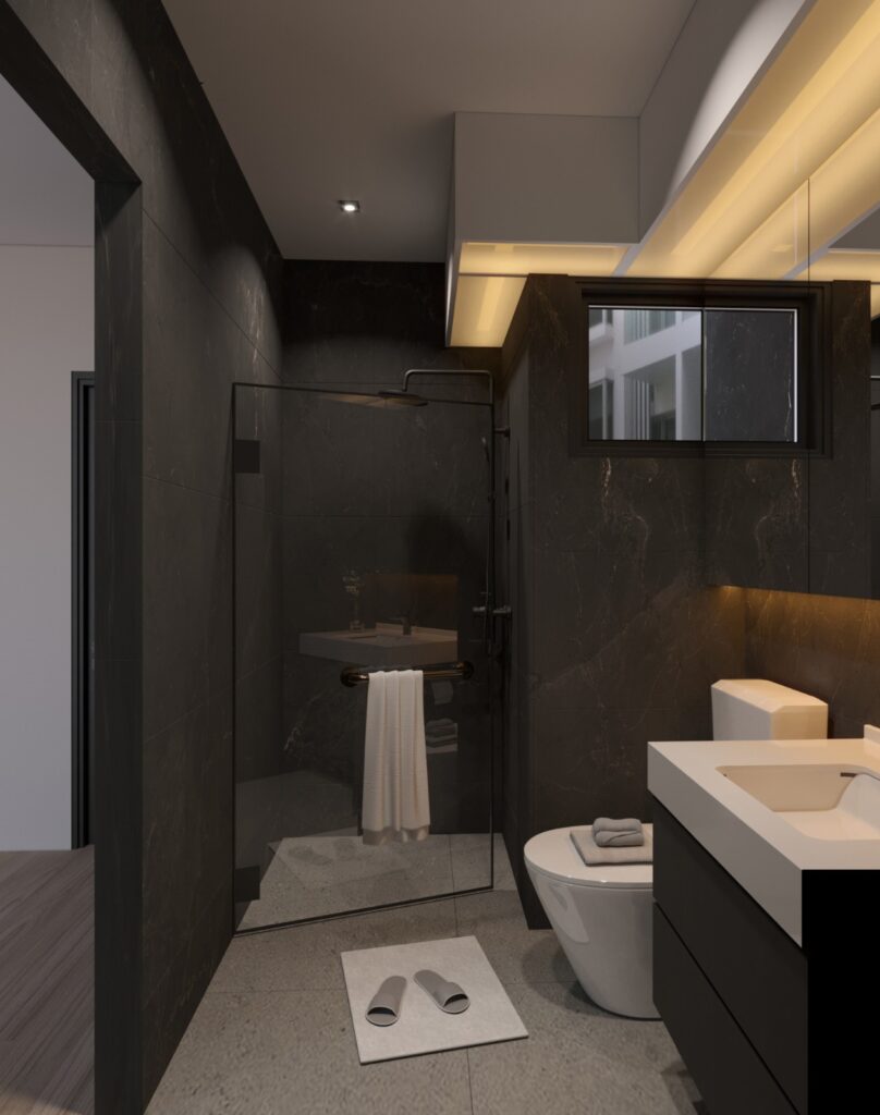 Bathroom with a glass shower screen, dark stone tiles and cove lighting